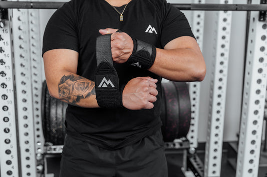 Athlete wraps wrists with REP® Wrist Wraps.