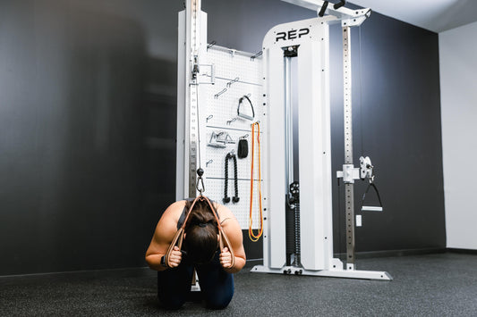 Athlete does a cable crunch on the Arcadia Max.