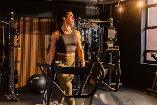 Athlete walks on the Strive™ Curved Treadmill.