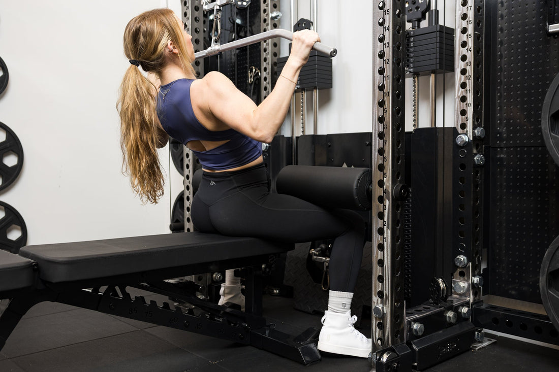 Athlete tackles lat pulldown with REP equipment.