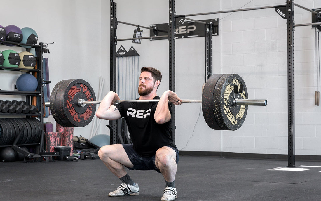 Athlete tackle a clean and jerk with REP equipment.