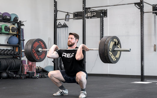 Athlete tackle a clean and jerk with REP equipment.
