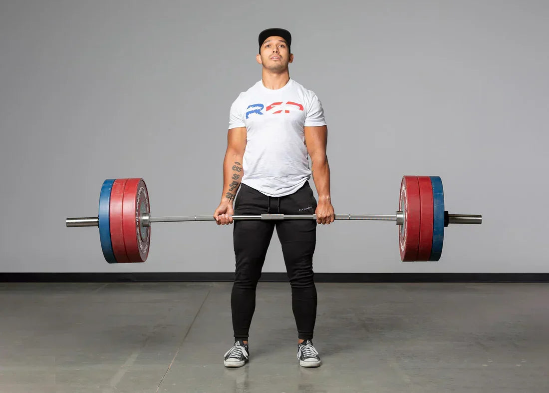 An athlete does a deadlift.