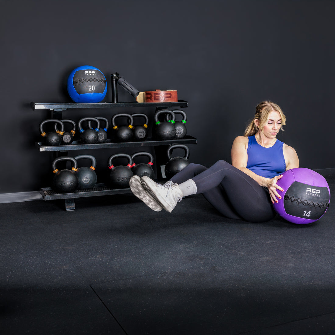Athlete working out in front of the REP Fitness 3-Tier Kettlebell Rack 2.0