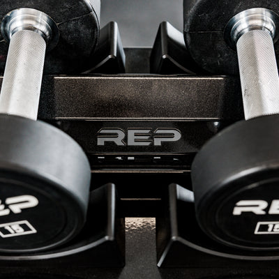 Close-up of the branding on the REP Fitness Commercial Dumbbell round dumbbell Rack