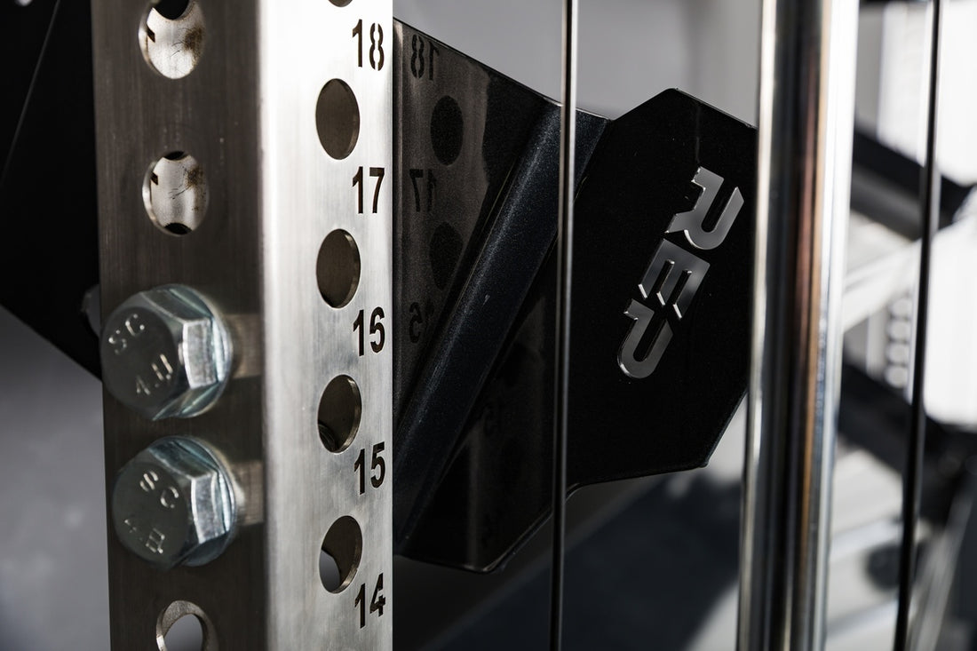 Close-up of how the REP Fitness 82" Dumbbell & Kettlebell Shelves are bolted to the rack uprights