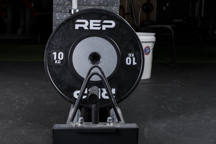 Black Competition Bumper Plates (KG) stored in a Horizontal Plate Rack