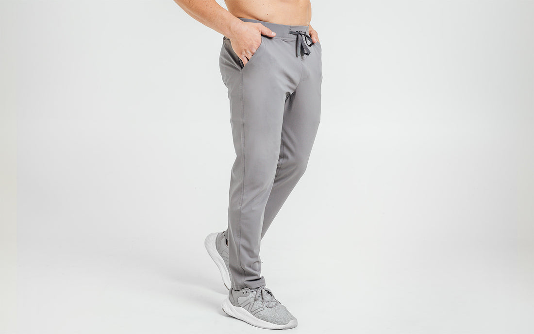 The REP Fitness Men's Felix Pants in Cool Gray on body, side view