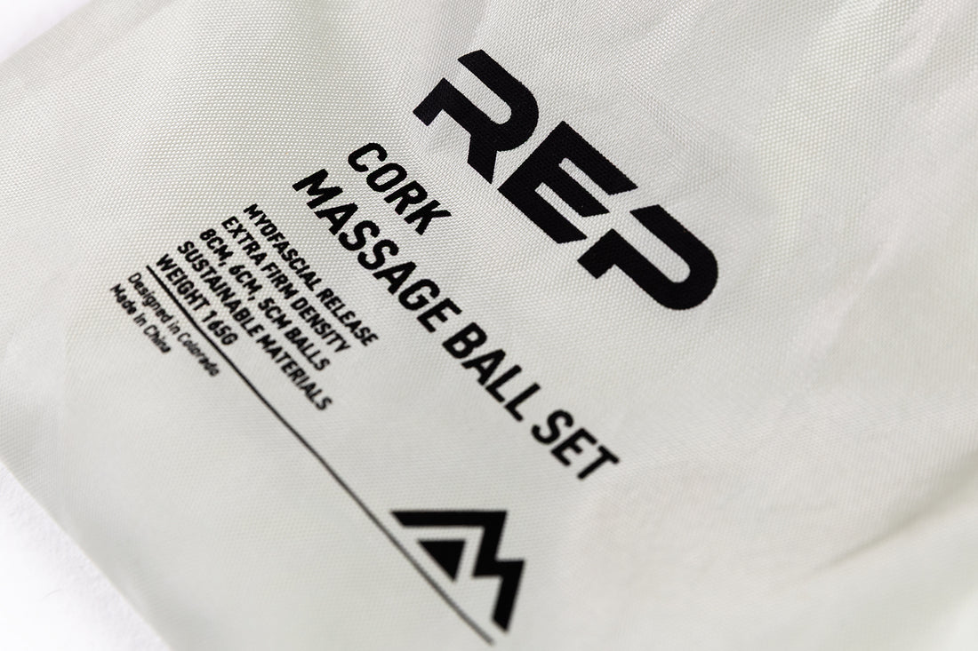 Close-Up: REP Cork Massage Ball Set product details printed on the drawstring carrying bag.