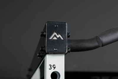 Close-up shot of the branded crossmembers on the REP Fitness Altitude™ Power Rack