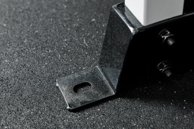 Shot of the bolt-down holes on the footplate of the REP Fitness Altitude™ Power Rack