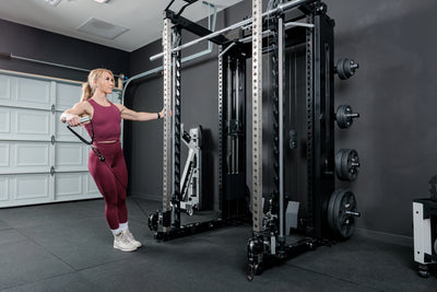 Athlete doing a shoulder workout with the REP Fitness Altitude™ Power Rack Cable Attachment
