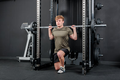Athlete using the REP Fitness Altitude™ Power Rack Smith Machine Attachment for lunges