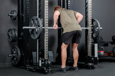 Athlete using the REP Fitness Altitude™ Power Rack Smith Machine Attachment for bent over rows
