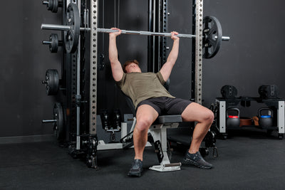 Athlete using the REP Fitness Altitude™ Power Rack Smith Machine Attachment for incline bench press