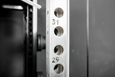 Close-up shot of the numbered rack uprights on the REP Fitness Altitude™ Power Rack