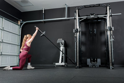 Athlete doing a landmine workout with the REP® x Kleva Built® Adroit Landmine on the Altitude™ Power Rack