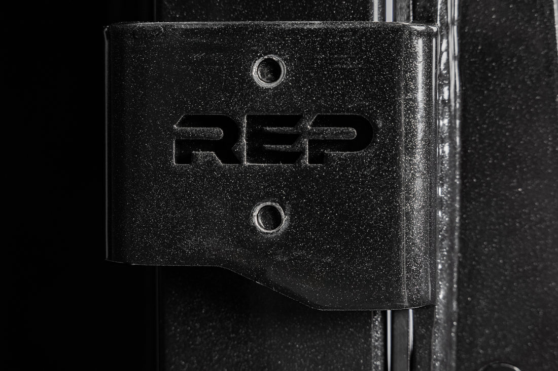Close-up shot of the laser-cut branding on the REP Fitness Altitude™ J-Cups