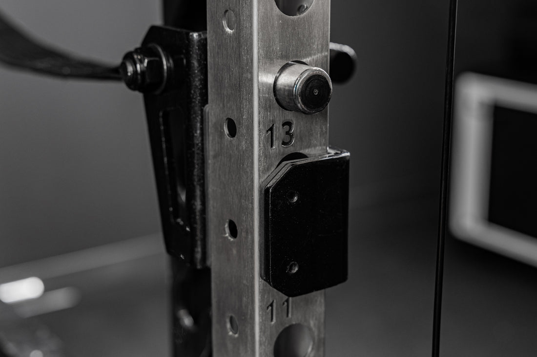 Backside of the REP Fitness Altitude™ Power Rack Strap Safeties on a rack upright