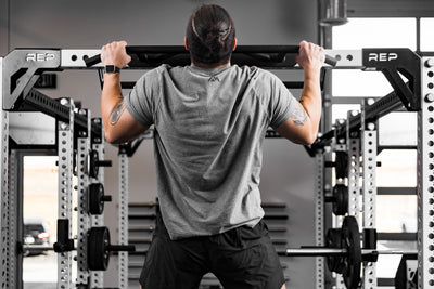 Athlete doing pull-ups on the Crossmember Multi-Grip Pull-Up Bar