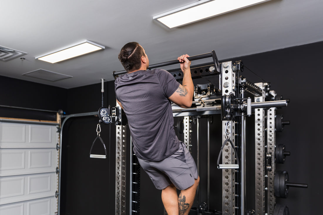 Athlete doing pull-ups on the REP Fitness Crossmember Pull-Up Bar