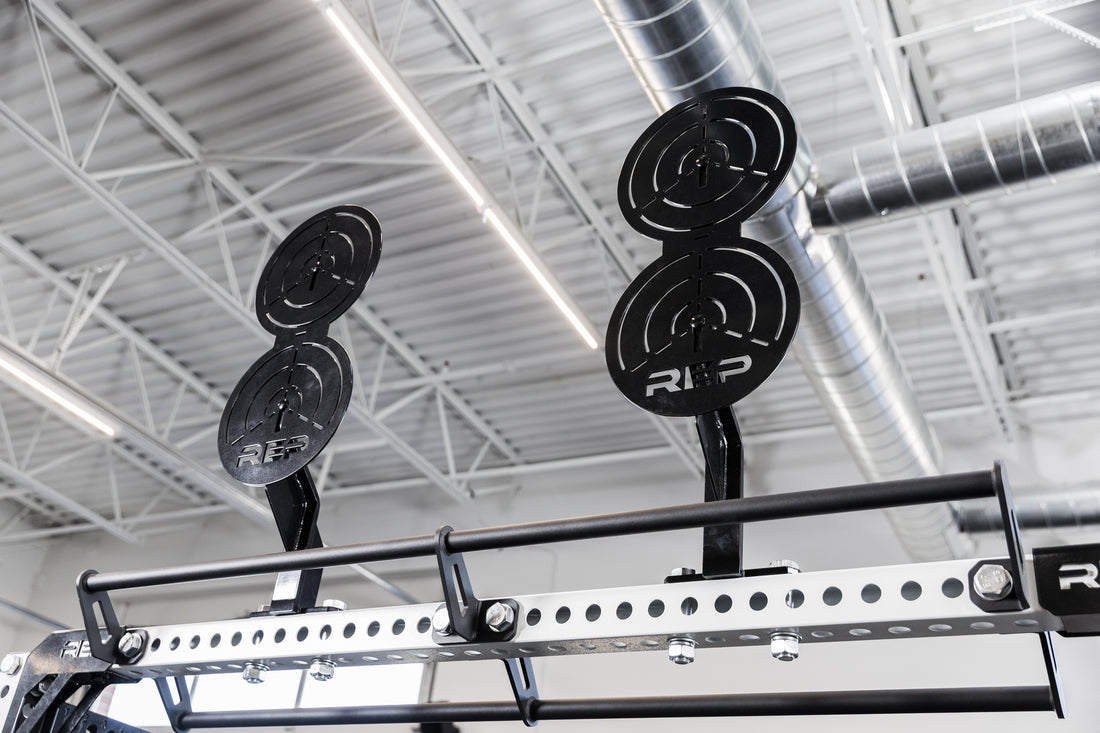 Two of the REP Fitness Crossmember Mount Wall Ball Targets on an 82 inch crossmember