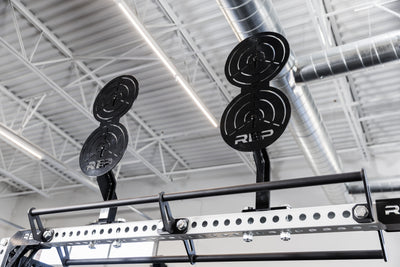 Two of the REP Fitness Crossmember Mount Wall Ball Targets on an 82 inch crossmember