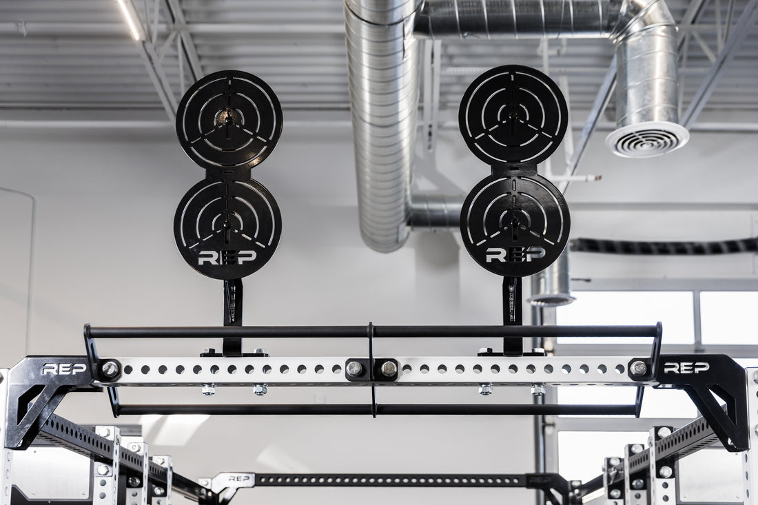 Two of the REP Fitness Crossmember Mount Wall Ball Targets on an 82 inch crossmember