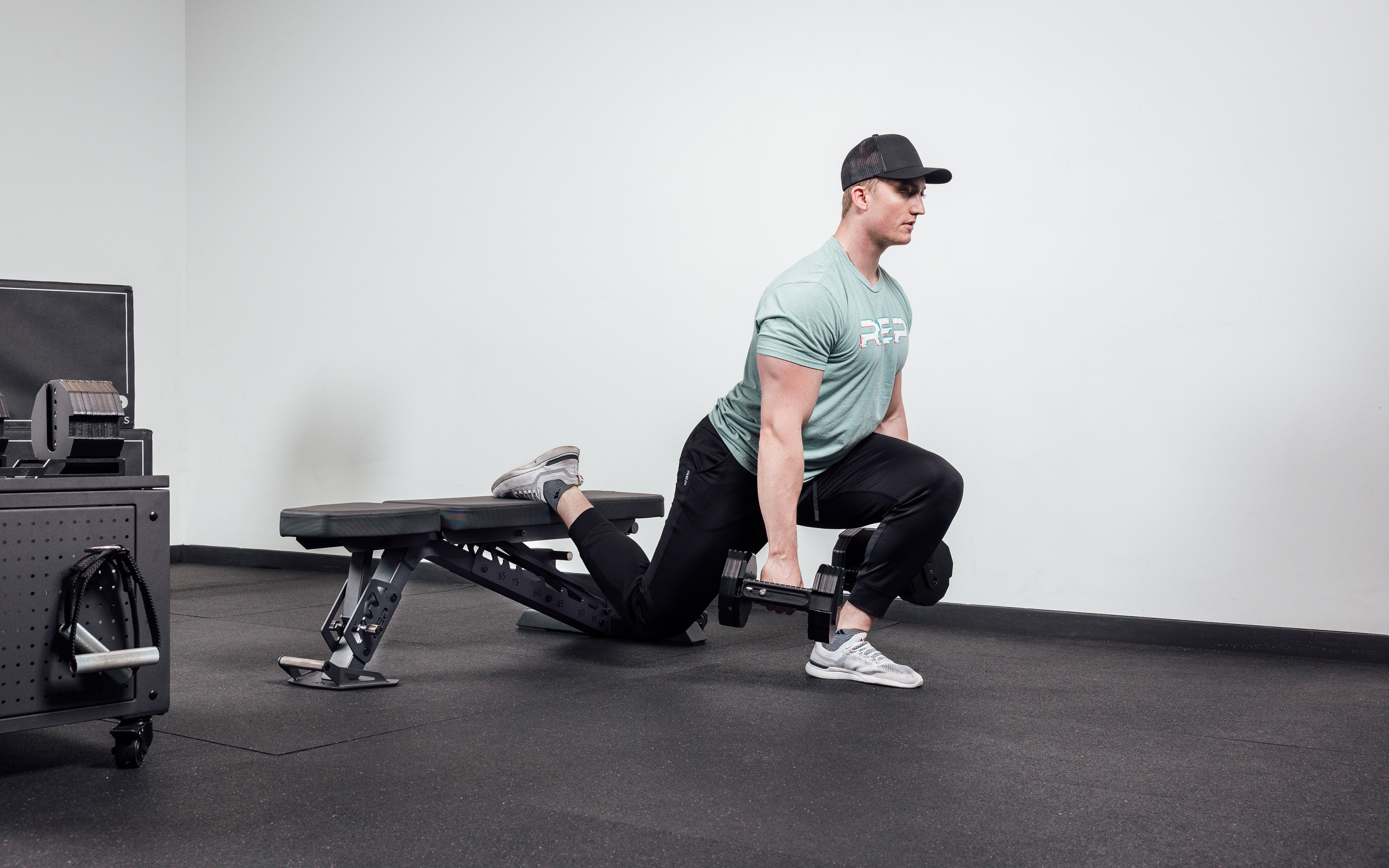 Joe doing bulgarian split squats on bench