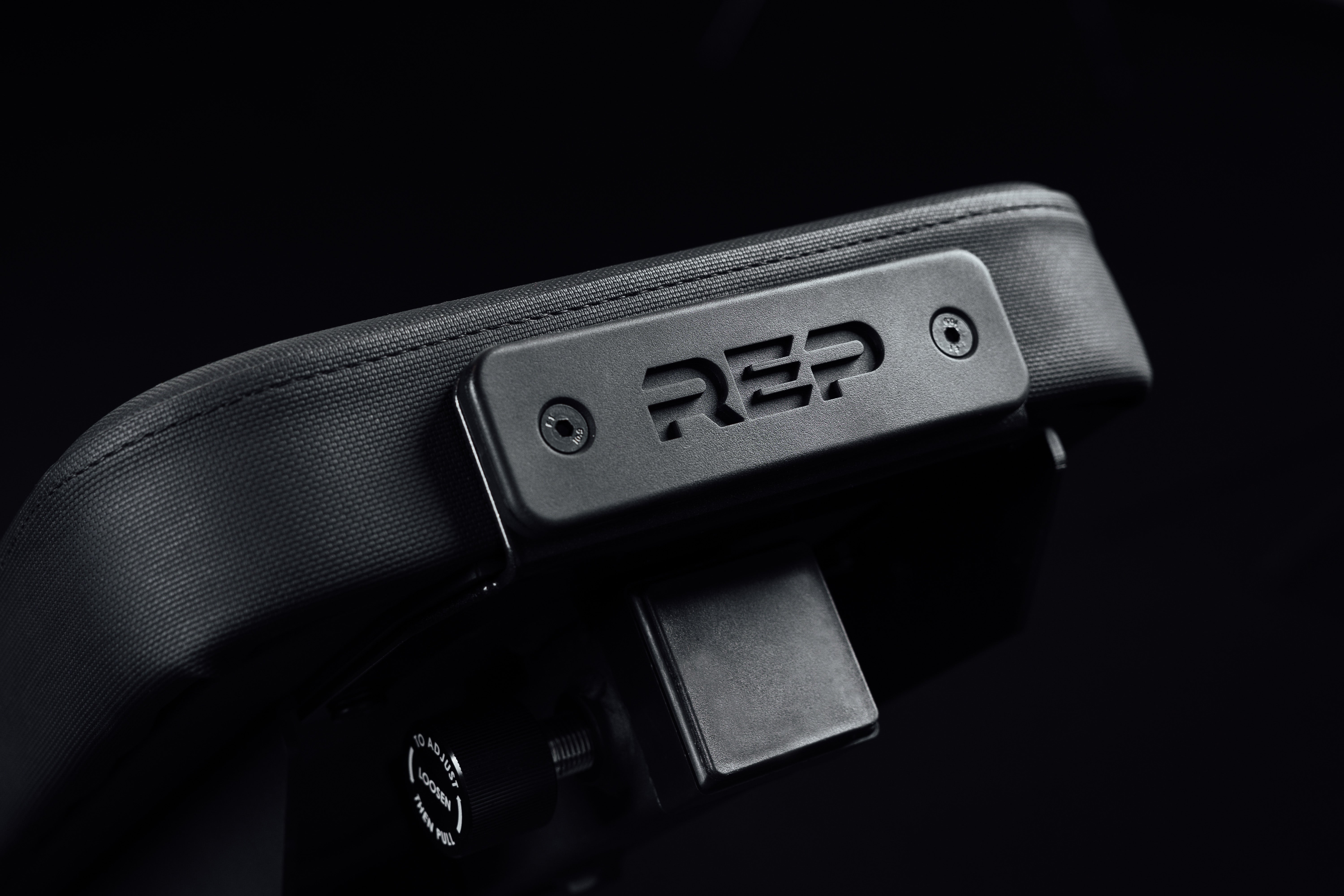 Rep on the end of the bench where leg roller is attached