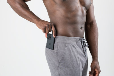 The REP Fitness Men's Apollo Joggers in Heather Cool Gray front, phone in pocket