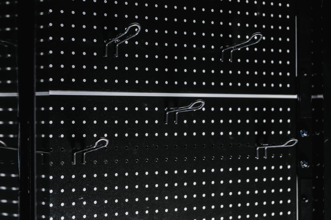 Pegboard storage hooks on a black Arcadia Max