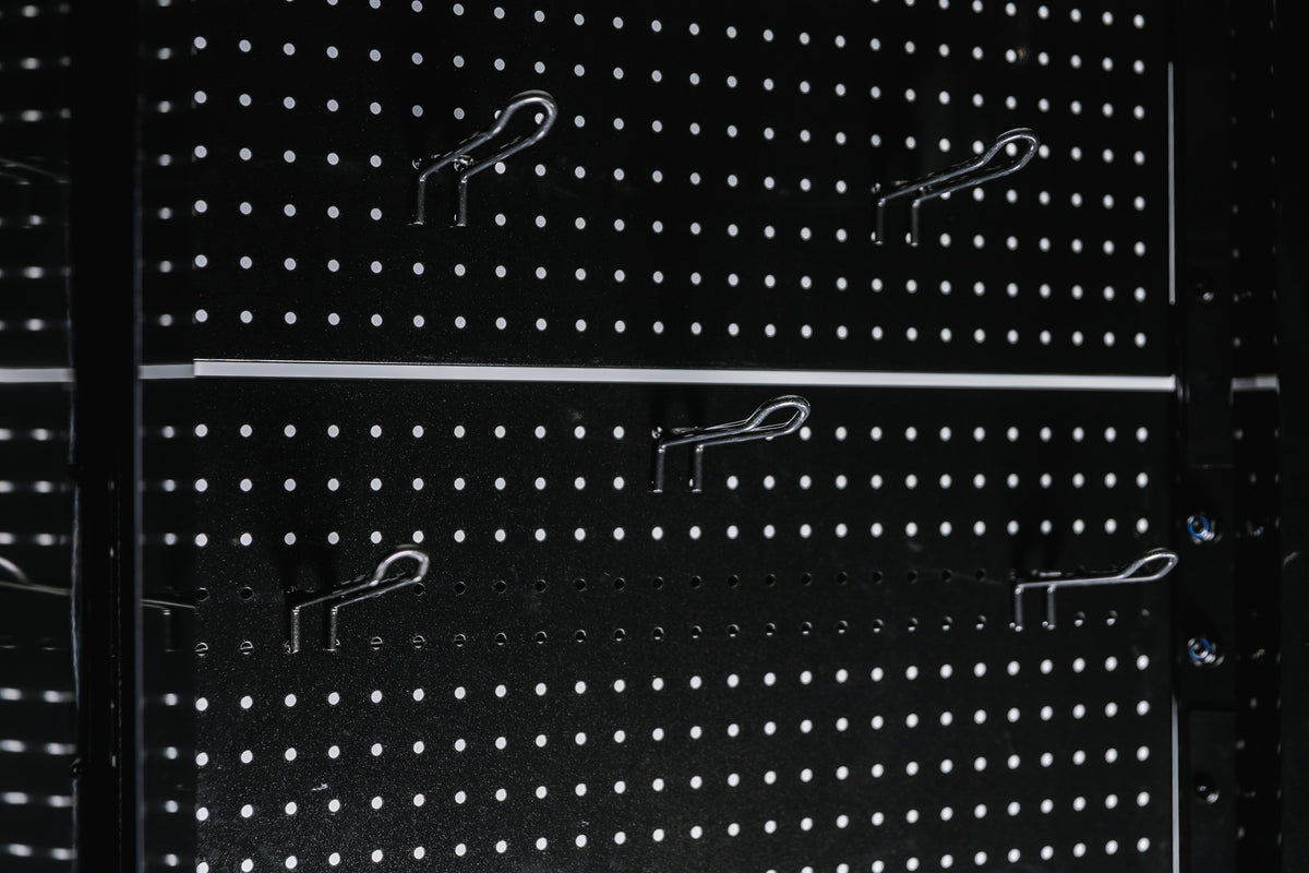 Pegboard storage hooks on a black Arcadia Max