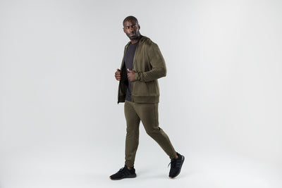 The REP Fitness Men's Attis Jacket in Heather Olive front, walking, jacket open