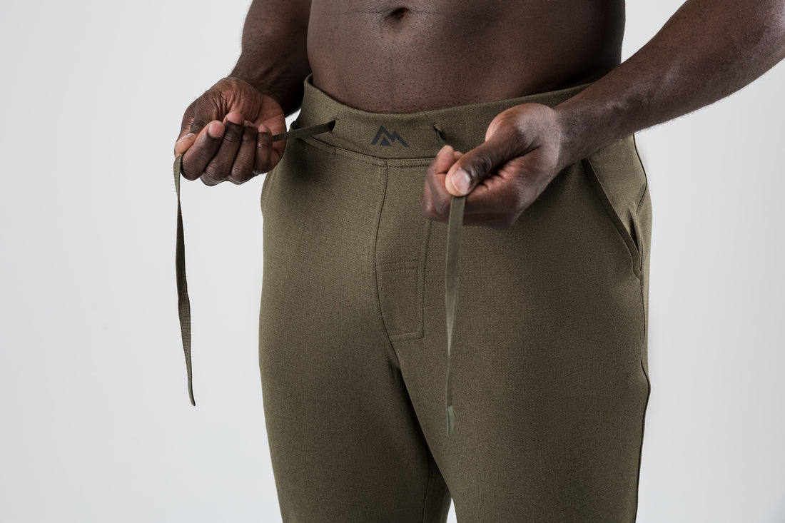 The REP Fitness Men's Attis Joggers in Heather Olive front, drawstring detail