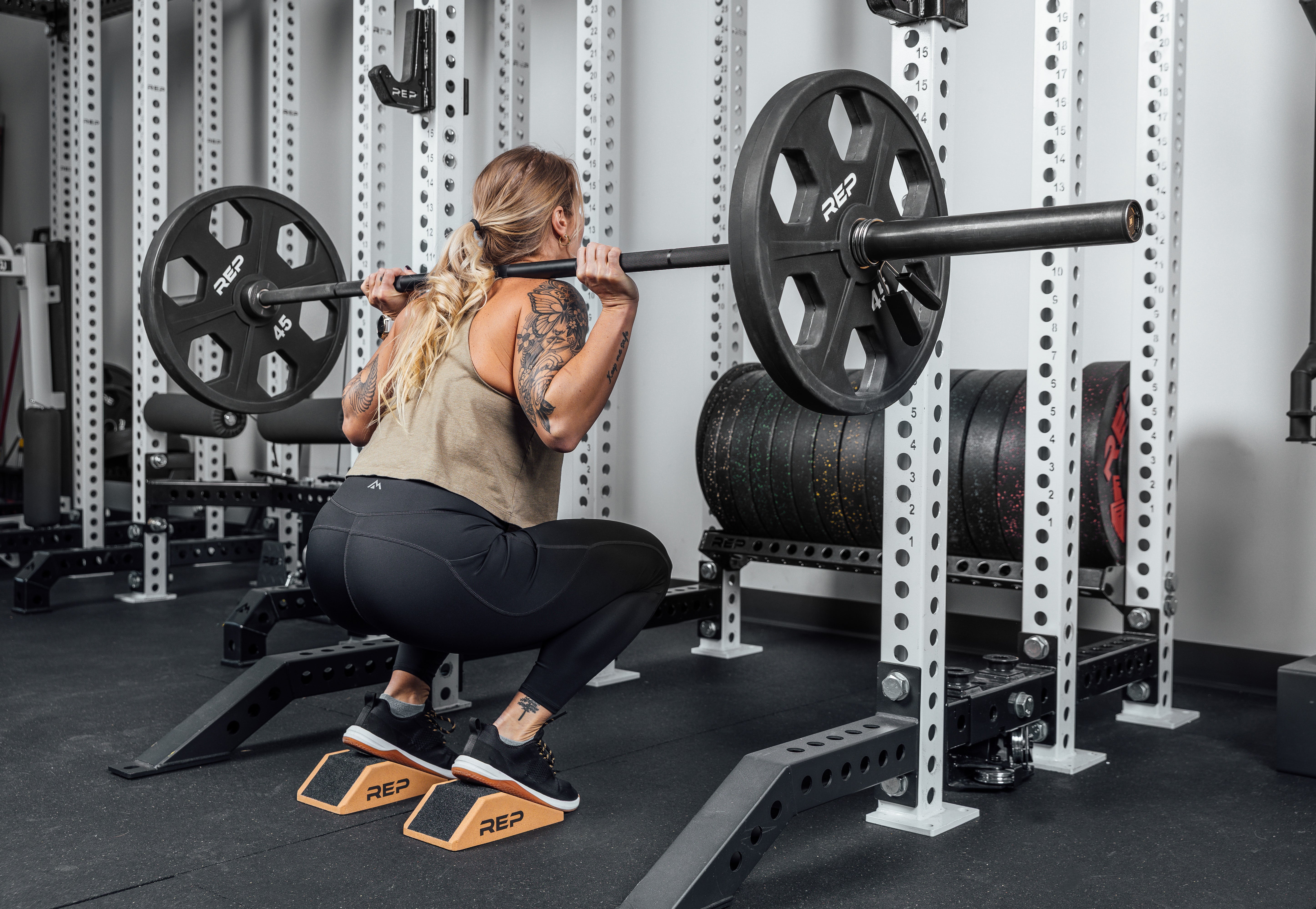 Athlete squatting using Cork Squat Wedges