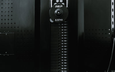Adonis™ Cable Tower. Close up of selectorized weight stack and additional weight on the weight horns