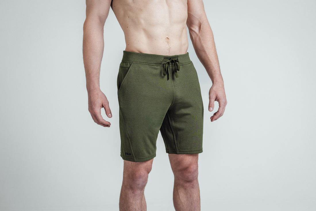 The REP Fitness Men's Attis Shorts in Heather Olive on body