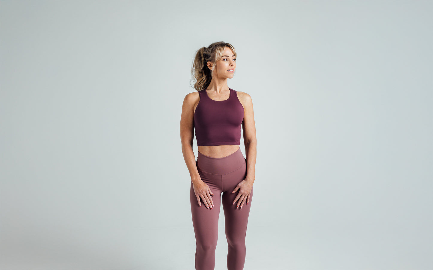 Front shot of an athlete wearing the REP Rhea Tank in Wine