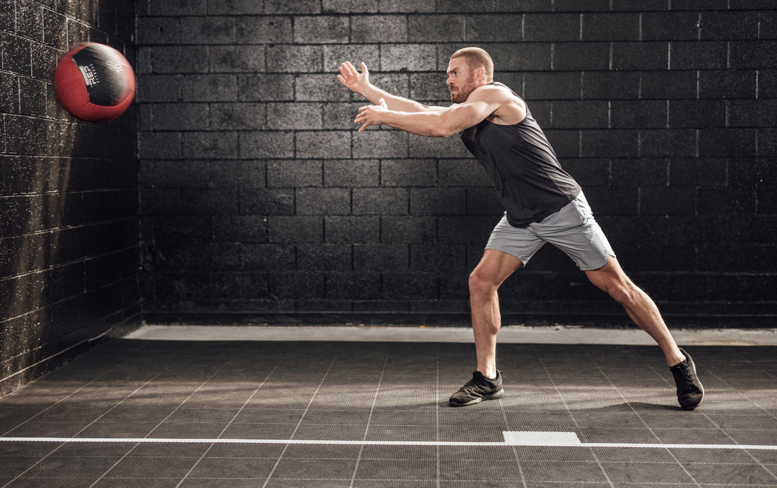 The REP Fitness Men's Motus Shorts in Silver front, med ball throw