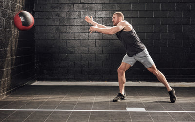 The REP Fitness Men's Motus Shorts in Silver front, med ball throw