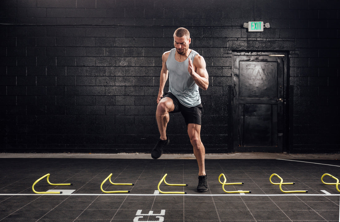 The REP Fitness Men's Motus Shorts in Black front, agility drill