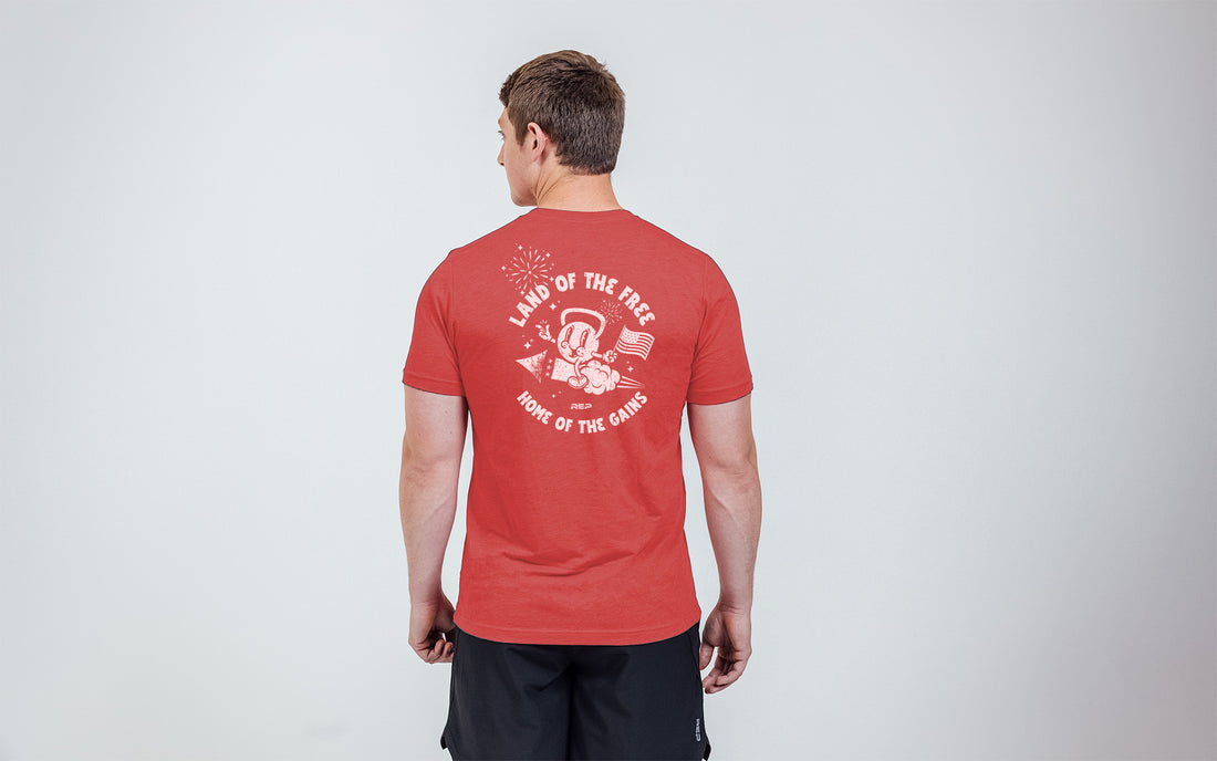 The REP Fitness Men's Liberty Bell Tri-Blend Crew T-Shirt in Heather Red/White back, on model