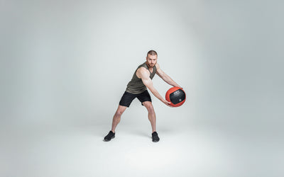The REP Fitness Men's Motus Shorts in Black front, med ball