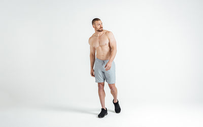 The REP Fitness Men's Motus Shorts in Silver front, walking