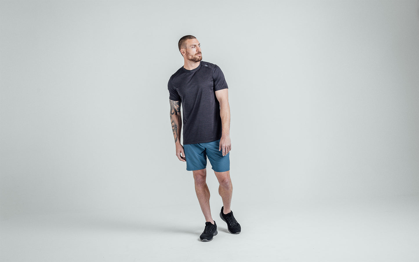 Athlete wearing Heather Black Sigmatech Shirt