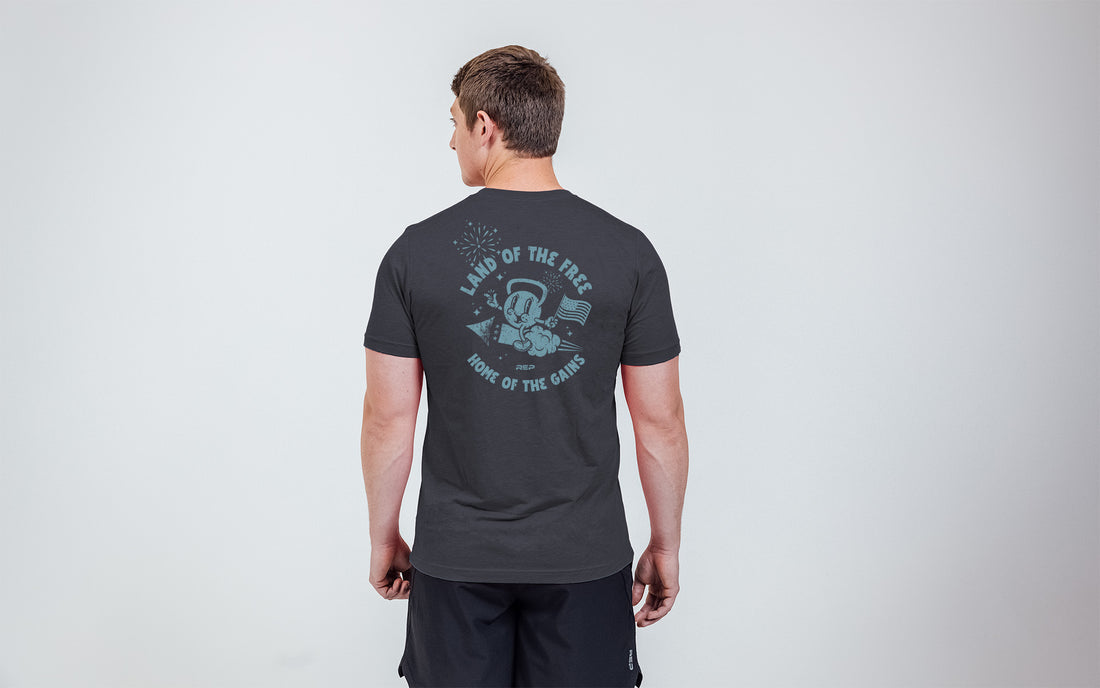 The REP Fitness Men's Liberty Bell Tri-Blend Crew T-Shirt in Heather Black/Blue back, on model