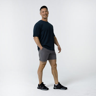 The REP Fitness Men's Magnis Heavyweight T-Shirt in Navy side on body shot