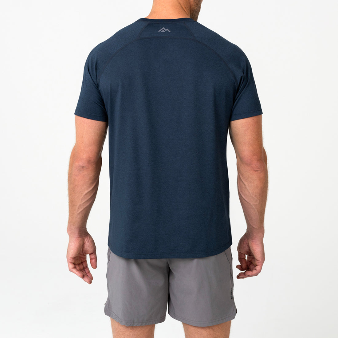 The REP Fitness Men's Aerix Tee in Heather Navy back, model shot
