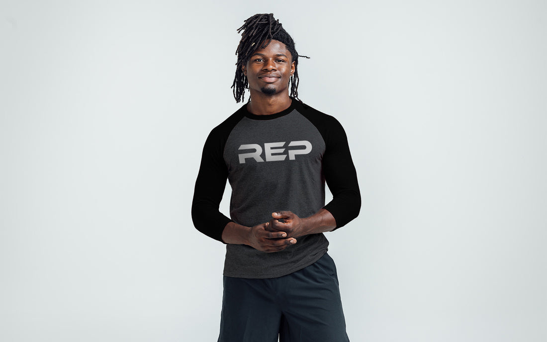 The REP Fitness Men's Daily Driver ¾ Sleeve Tri-Blend Crew T-Shirt in Heather Black/White on body